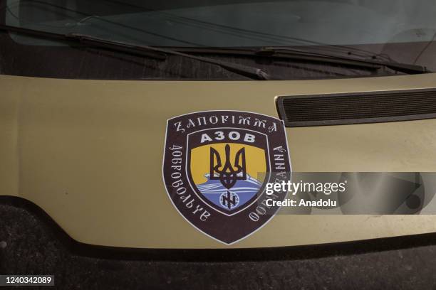 Van with Azov symbol on the bonnet is seen at the center of Azov Battalion in Zaporizhzhia, Ukraine, on March 31, 2022. This center works as a base...