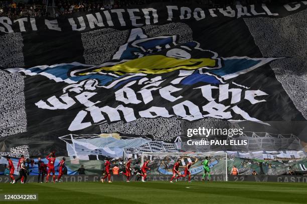 Newcastle's fans cheer prior to the English Premier League football match between Newcastle United and Liverpool at St James' Park in...