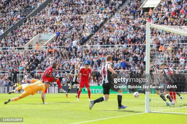 Naby Keita of Liverpool scores a goal to make it 0-1 during the Premier League match between Newcastle United and Liverpool at St. James Park on...