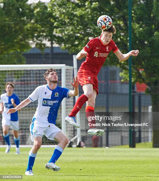 James McConnell of Liverpool and Charlie Weston of Blackburn Rovers in action at AXA Training Centre on April 30, 2022 in Kirkby, England.