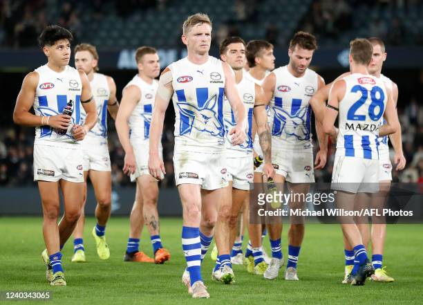 The Kangaroos look dejected after a loss during the 2022 AFL Round 07 match between the Carlton Blues and the North Melbourne Kangaroos at Marvel...