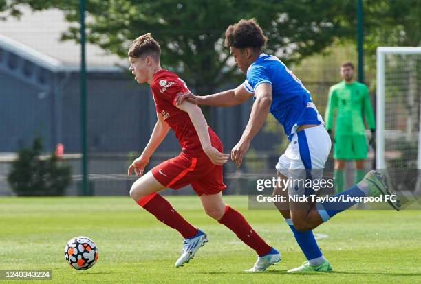 James McConnell of Liverpool and Leonard Duru of Blackburn Rovers in action at AXA Training Centre on April 30, 2022 in Kirkby, England.