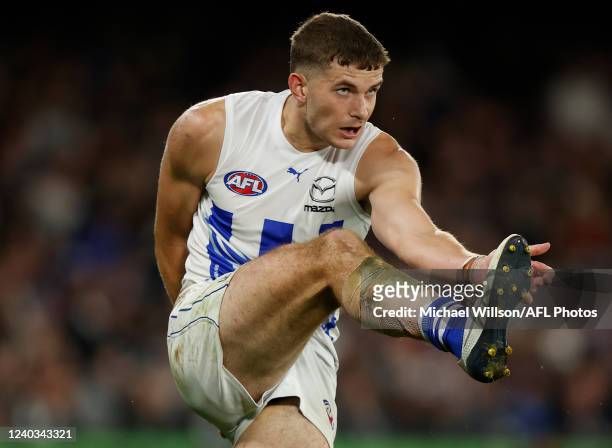 Callum Coleman-Jones of the Kangaroos kicks the ball during the 2022 AFL Round 07 match between the Carlton Blues and the North Melbourne Kangaroos...