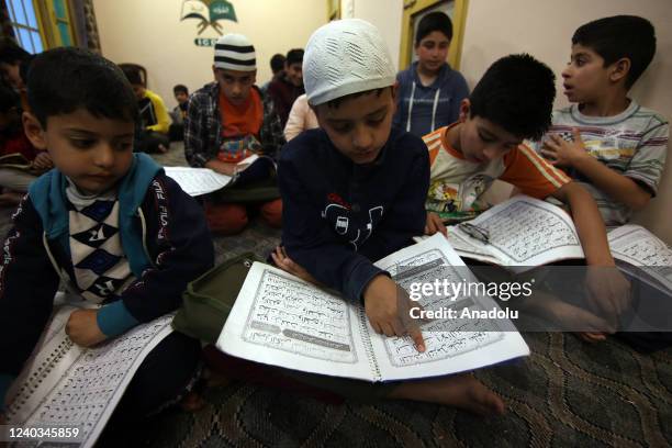 Students attend Quran classes at a madrassa before 'Iftar' in the holy month of Ramadan in Srinagar on April 30, 2022.