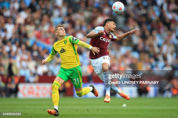 Aston Villa's English striker Ollie Watkins vies with Norwich City's English defender Brandon Williams during the English Premier League football...