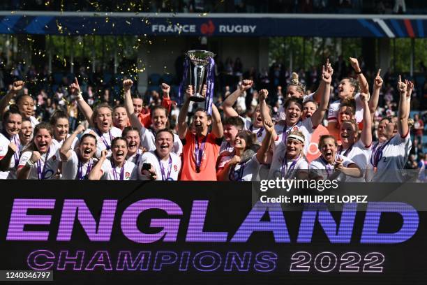 English players celebrate their Grand Slam victory after winning the Six Nations international women's rugby union match between France and England...