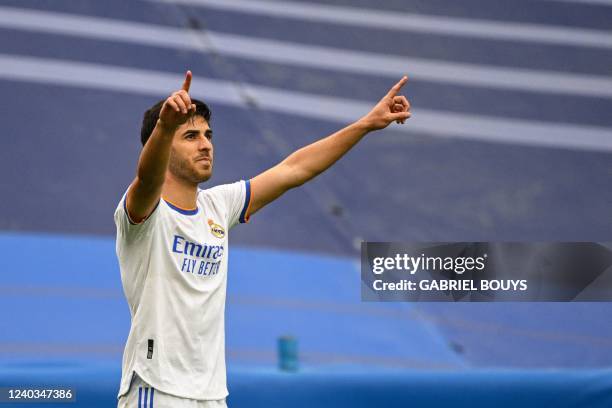 Real Madrid's Spanish midfielder Marco Asensio celebrates after scoring his team's third goal during the Spanish League football match between Real...