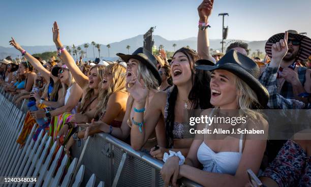 The crowd cheers as Midland performs at sunset on the Mane Stage on the first day of the three-day Stagecoach Country Music Festival at the Empire...