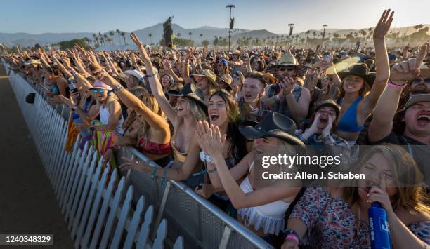 The crowd cheers as Midland performs at sunset on the Mane Stage on the first day of the three-day Stagecoach Country Music Festival at the Empire...