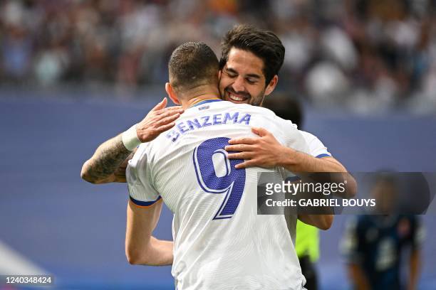 Real Madrid's French forward Karim Benzema celebrates with Real Madrid's Spanish midfielder Isco after scoring a goal during the Spanish League...
