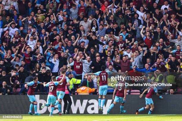 Burnley fans celebrate enthusiastically as the Burnley players run the length of the pitch to celebrate their winning goal during the Premier League...