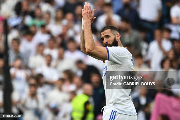 Real Madrid's French forward Karim Benzema celebrates at the end of the Spanish League football match between Real Madrid CF and RCD Espanyol at the...