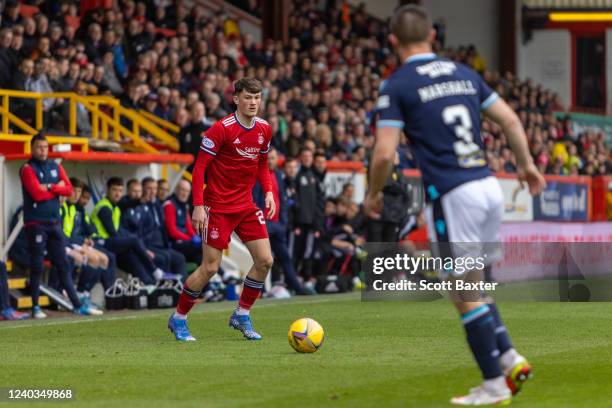 Calvin Ramsay of Aberdeen in action during the Cinch Scottish Premiership match between Aberdeen FC and Dundee FC at Pittodrie Stadium on April 30,...