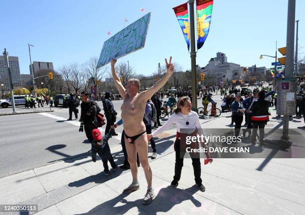 Protester is greeted by supporter at the Rolling Thunder Convoy protest on April 30, 2022 in Ottawa, Canada. Two months after a trucker-led...