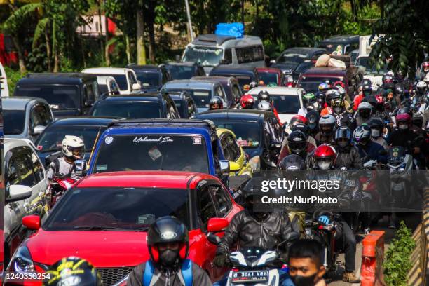 Motorists are stuck in traffic jams two days ahead of eid al Fitr on April 30 in Nagreg, Bandung Regency, Indonesia. Millions of people started to...