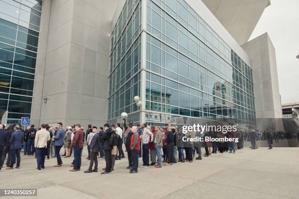 Attendees wait in line outside the CHI Health Center during the Berkshire Hathaway annual meeting in Omaha, Nebraska, U.S., on Saturday, April 30,...