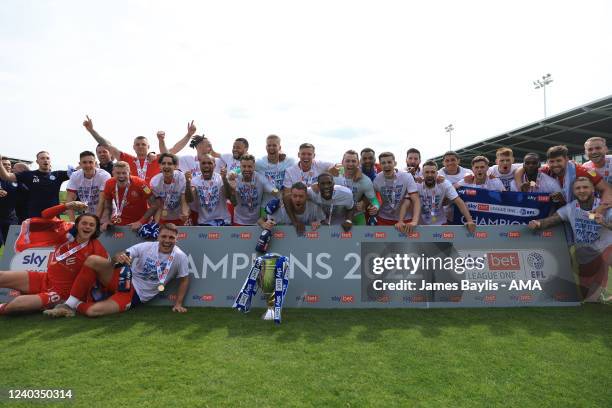 Wigan Athletic players celebrate winning the Sky Bet League One and winning promotion to the Championship after the Sky Bet League One match between...
