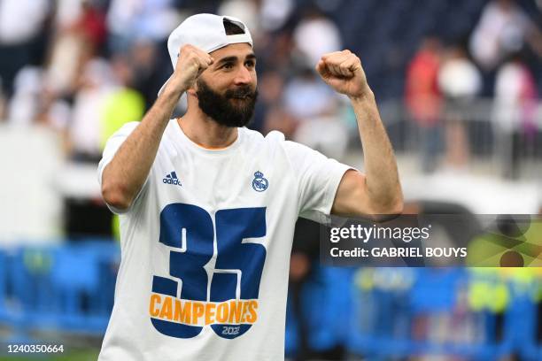 Real Madrid's French forward Karim Benzema celebrates at the end of the Spanish League football match between Real Madrid CF and RCD Espanyol at the...