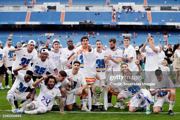Players of Real Madrid celebrates the championship with the trophy during the La Liga Santander match between Real Madrid v Espanyol at the Santiago...