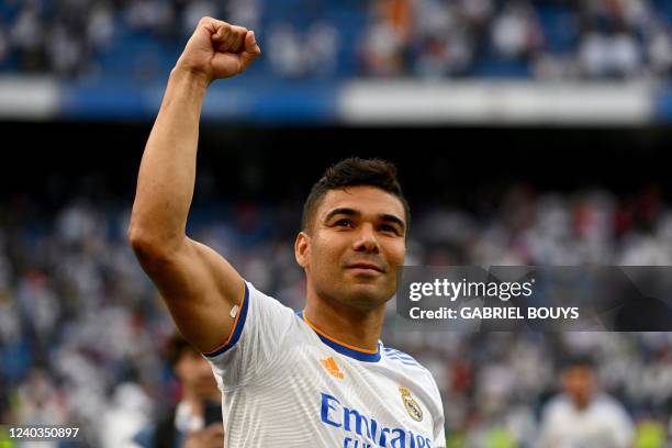 Real Madrid's Brazilian midfielder Casemiro celebrates at the end of the Spanish League football match between Real Madrid CF and RCD Espanyol at the...