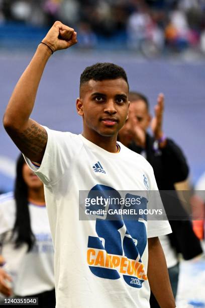 Real Madrid's Brazilian forward Rodrygo celebrates at the end of the Spanish League football match between Real Madrid CF and RCD Espanyol at the...