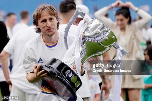 Luka Modric of Real Madrid celebrates the championship with the trophy during the La Liga Santander match between Real Madrid v Espanyol at the...