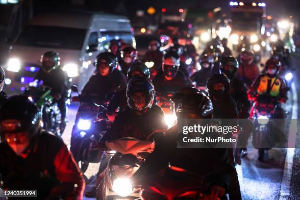 People ride motorbikes for homecoming travel to celebrate the upcoming Eid al-Fitr festival in Karawang, West Java, Indonesia, April 29, 2022. The...