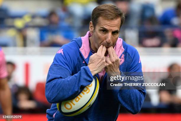 Stade Francais' Argentinian coach Gonzalo Quesada whistles with his fingers during the French Top 14 rugby union match between ASM Clermont and Stade...