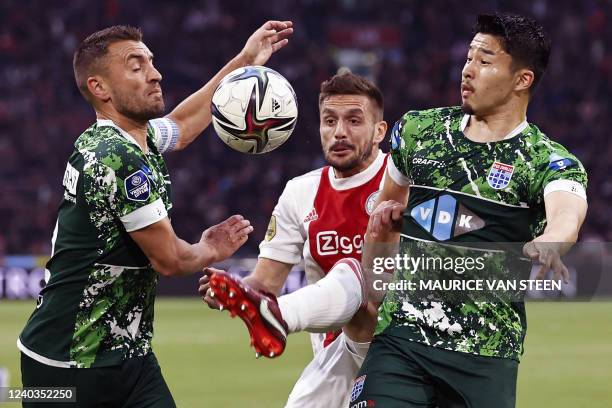 Zwolle Dutch defender Bram van Polen fights for the ball against Ajax's Serbian forward Dusan Tadic and PEC Zwolle Japan's defeder Yuta Nakayama...