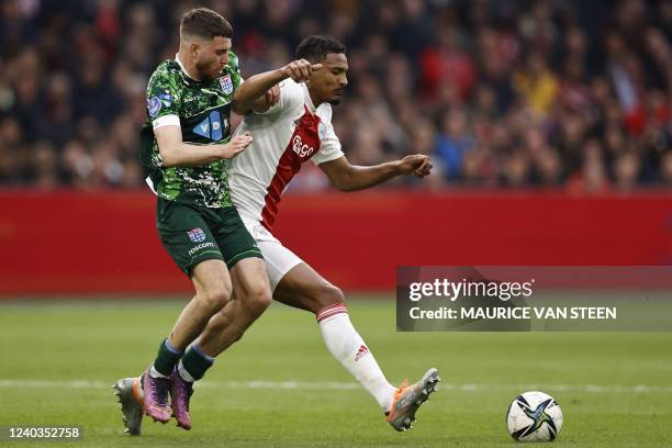 Zwolle Dutch defender Mees de Wit fights for the ball against Ajax's Ivorian forward Sebastien Haller during the Dutch Eredivisie match between Ajax...