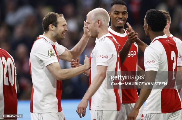 Ajax's Dutch defender Daley Blind and teammates Davy Klaassen, Ryan Gravenberch, Jurrien Timber celebrate a goal during the Dutch Eredivisie match...