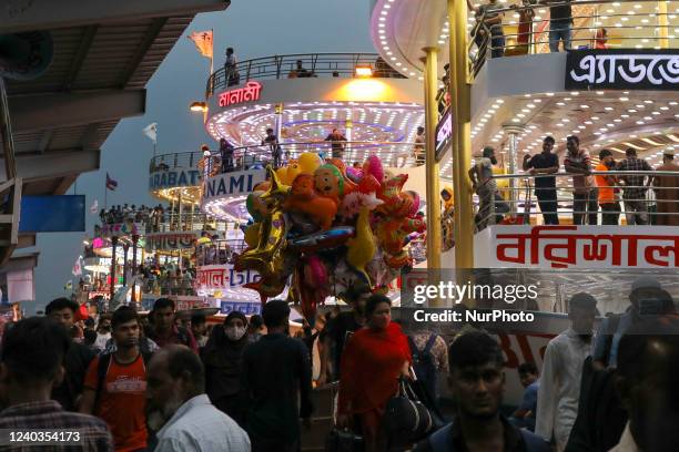 People board on ferries to travel to their native places to celebrate Eid al-Fitr, which marks the end of the Muslim's holy festival of Ramadan in...