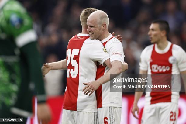 Ajax's Dutch midfielder Kenneth Taylor celebrates with teammate Dutch midfielder Davy Klaassen a goal during the Dutch Eredivisie match between Ajax...