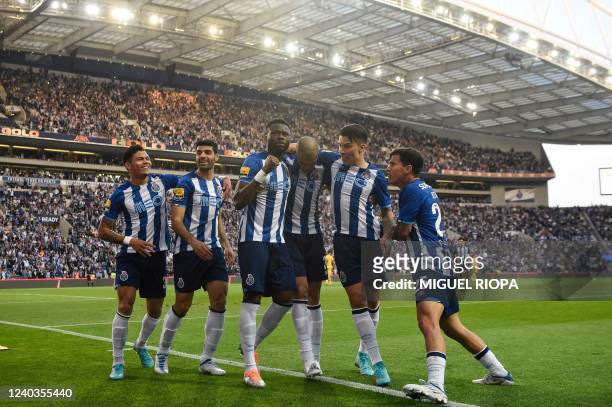 Porto's Congolese defender Chancel Mbemba celebrates with teammates after scoring a goal during the Portuguese League football match between FC Porto...