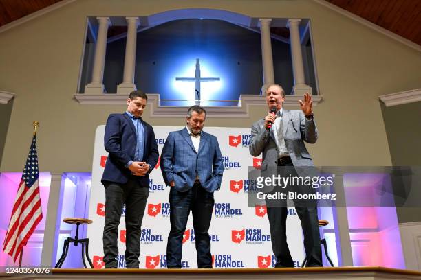 Josh Mandel, U.S. Republican senate candidate for Ohio, left, and Senator Ted Cruz, a Republican from Texas, center, pray with a Pastor during a...