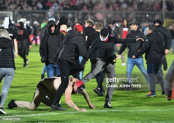 Rwdm's supporters invade the pitch and riot after a soccer match between 1A team RFC Seraing and 1B team RWD Molenbeek, Saturday 30 April 2022, in...