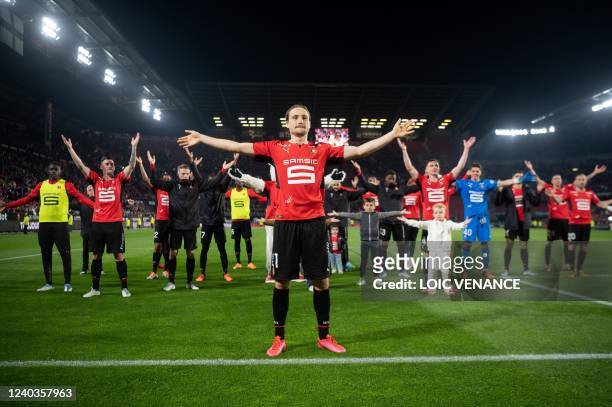 Rennes' French midfielder Lovro Majer and teammates celebrate their victory at the end of the French L1 football match between Stade Rennais FC and...