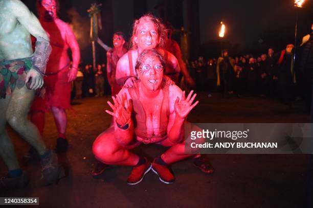Performers take part in the Beltane Fire Festival on Calton Hill in Edinburgh on April 30, 2022. - The annual event is inspired by the pre-Christian...