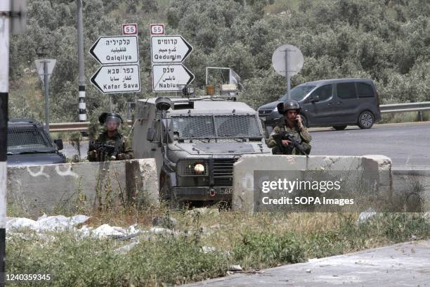 Israeli security forces gather at the entrances to Salfit Governorate and the town of Azzun, closing them off during the search for perpetrators of a...