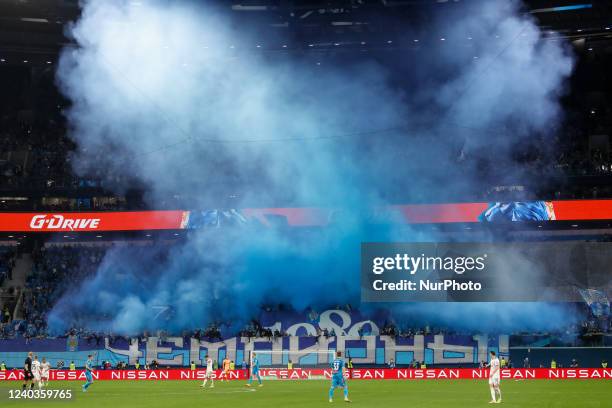 Zenit supporters perform ahead of the final whistle of the Russian Premier League match between FC Zenit Saint Petersburg and FC Lokomotiv Moscow on...