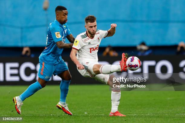 Malcom of Zenit St. Petersburg and Maksim Nenakhov of Lokomotiv Moscow vie for the ball during the Russian Premier League match between FC Zenit...