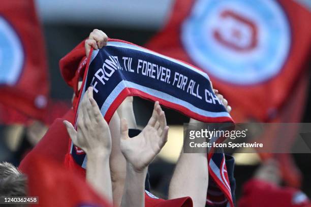 Chicago Fire fans celebrate with a Chicago Fire scarf in action during a game between the Chicago Fire and the New York Red Bulls on April 30, 2022...