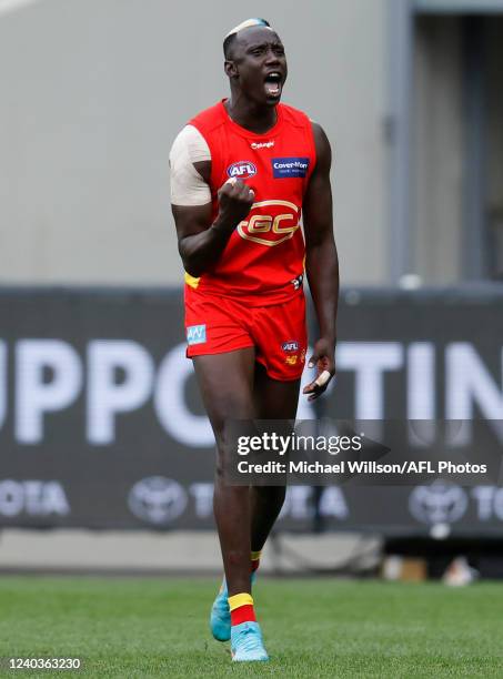 Mabior Chol of the Suns celebrates a goal during the 2022 AFL Round 07 match between the Collingwood Magpies and the Gold Coast Suns at the Melbourne...