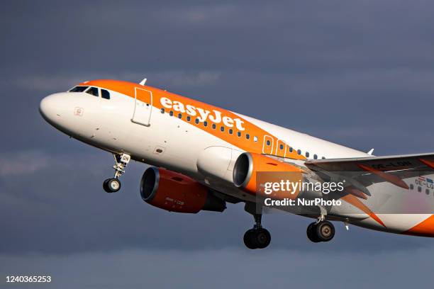 EasyJet Europe Airbus A319 aircraft as seen during taxiing, rotate and take off phase flying as departs from Amsterdam Schiphol Airport. The A319 has...