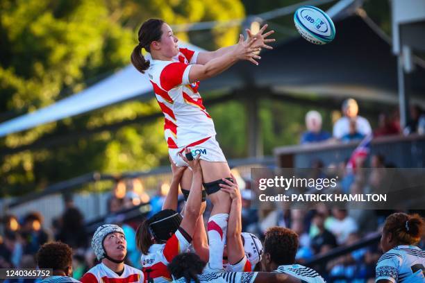 Japan's Iroha Nagata wins the line out ball during the women's rugby Test match between Fiji and Japan on the Gold Coast on May 1, 2022. - -- IMAGE...