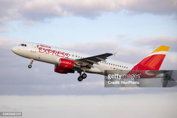 Iberia Express Airbus A320 aircraft as seen departing from Amsterdam Schiphol AMS EHAM airport. The passenger jet plane is passing in front of the...
