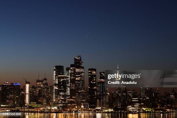 Venus and Jupiter are seen as almost conjunction over Manhattan before the sunrise in New York City, United States on May 1, 2022.