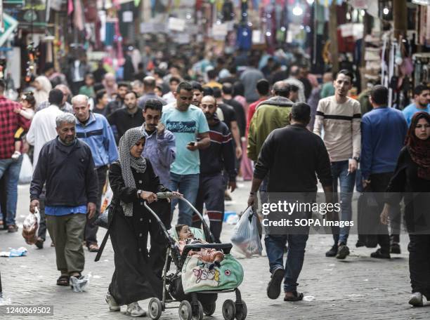 Palestinians shop in a local market ahead of the Eid al-Fitr festivities, celebrating the end of the holy Muslim fasting month of Ramadan.