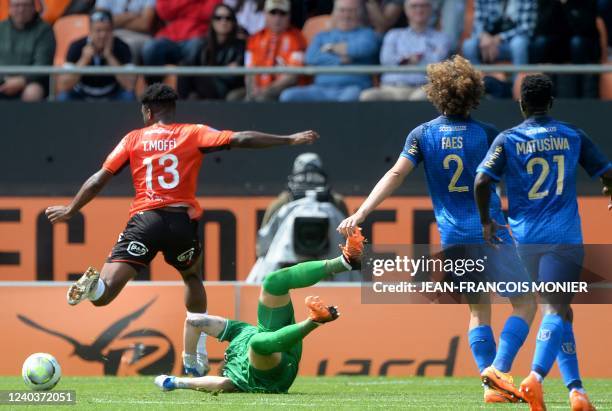 Lorient's Nigerian forward Terem Moffi scores next to Reims' Serbian goalkeeper Predrag Rajkovic during the French L1 football match between FC...