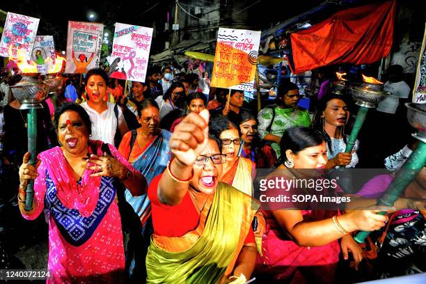 Sex workers shout slogans while marching with burning torches during the eve of International Labor Day. Sex workers of Sonagachi Kolkata, the...